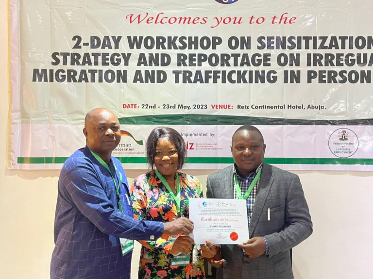 From Left-Right: Vincent Adekoye, the Press Officer of the National Agency for Prohibition of Trafficking In Persons (NAPTIP), Funke Ogunlolu of African Independent Television (AIT) while receiving certificate of participation from Dr Ajibola Abayomi, President Journalists International Forum For Migration (JIFORM) during a JIFORM workshop on sensitisation strategies against irregular migration and human trafficking supported by the Nigerian-German Center for Job Migration and Reintergration (NGC) on 23rd May, 2023 in Abuja.